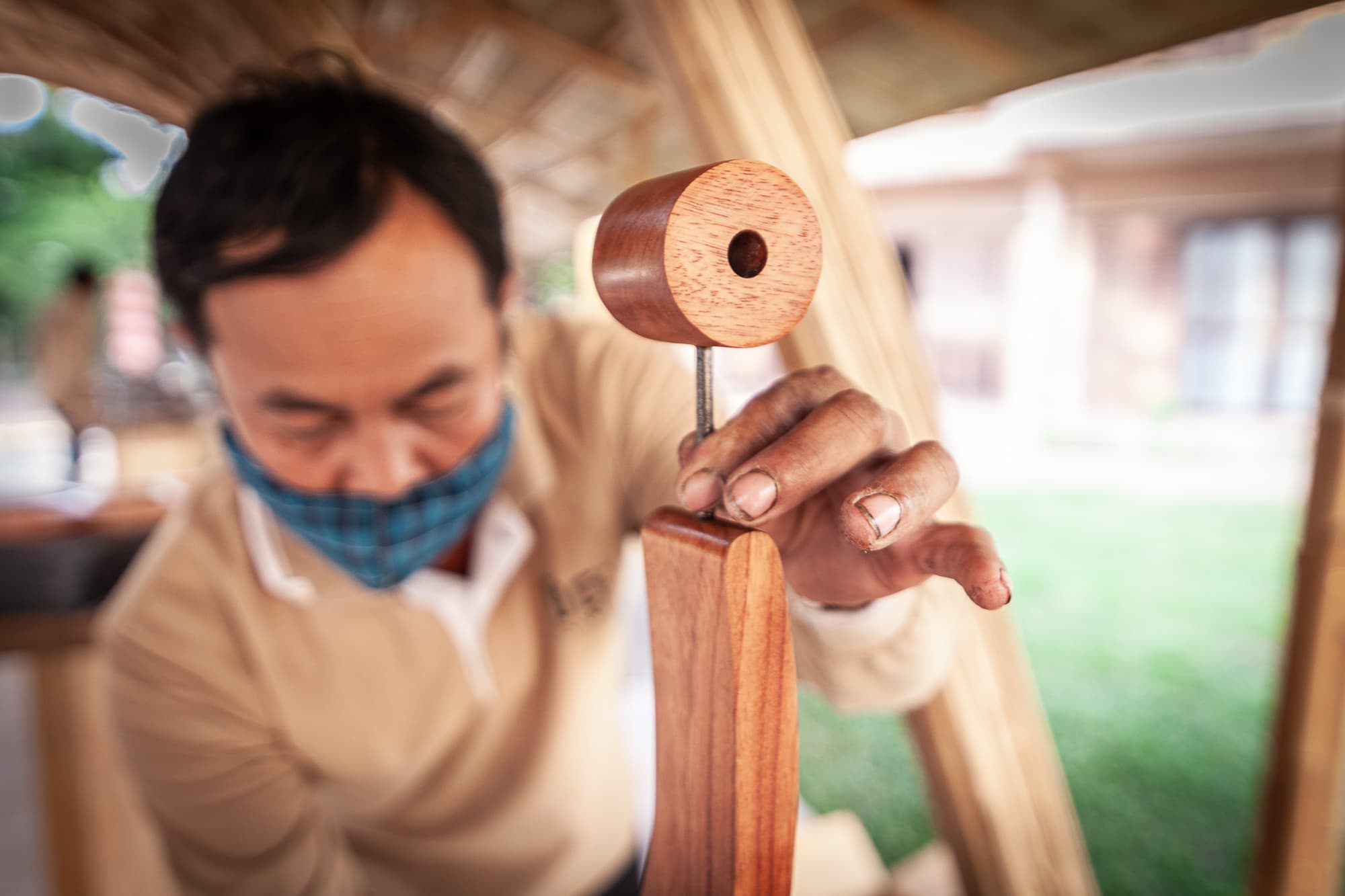 A woodcarver shaping a piece by hand.